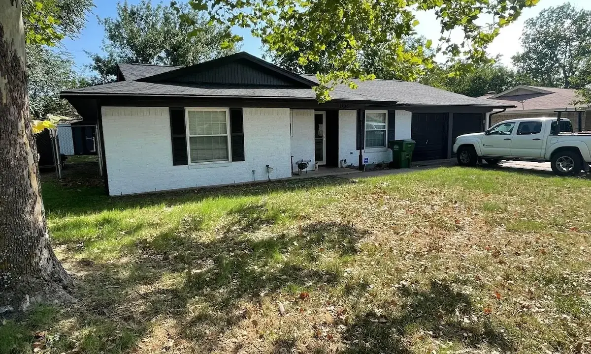 Professional roofing crew working on a residential roof in Mint Hill